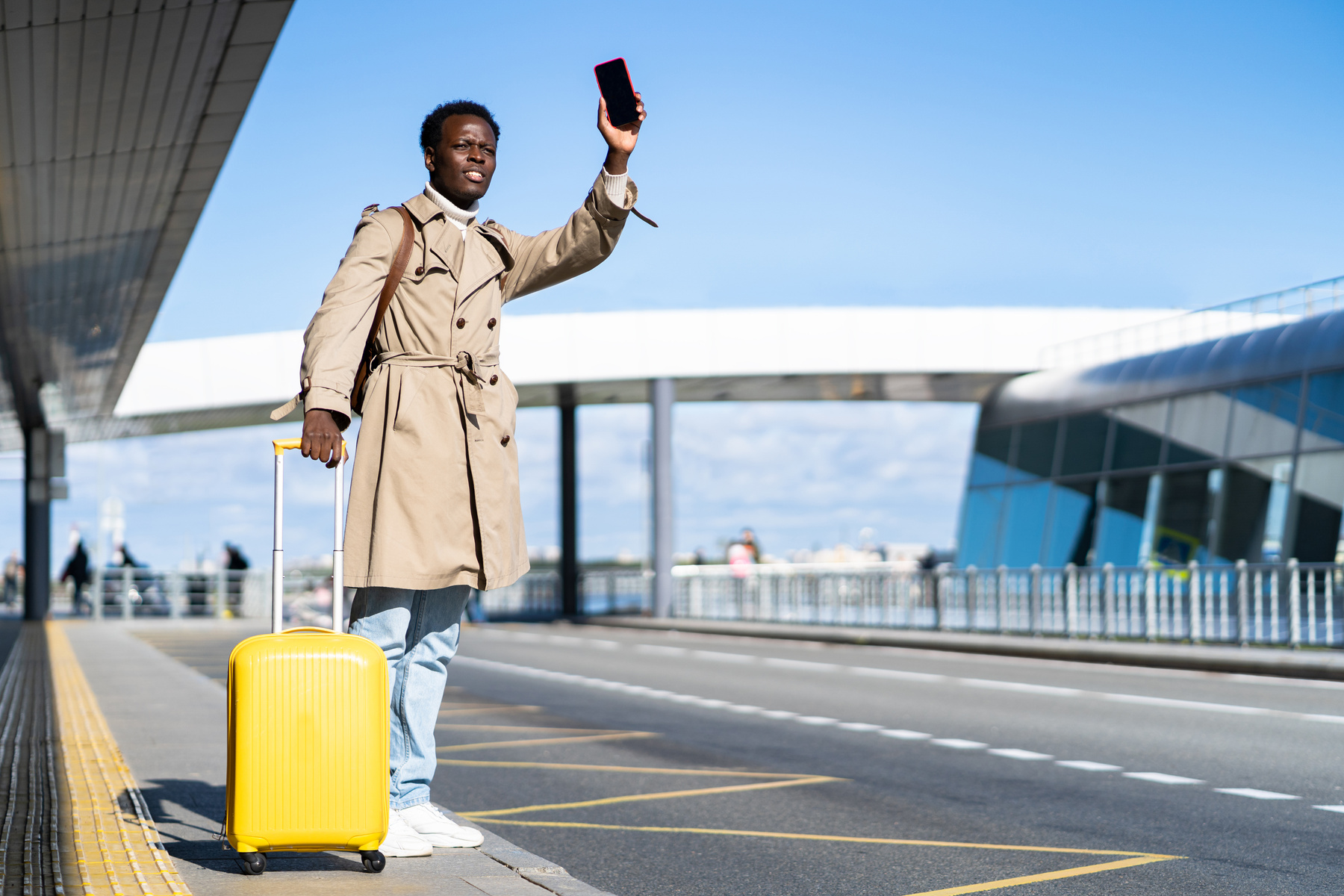 Man Waiting for Taxi Outside Airport