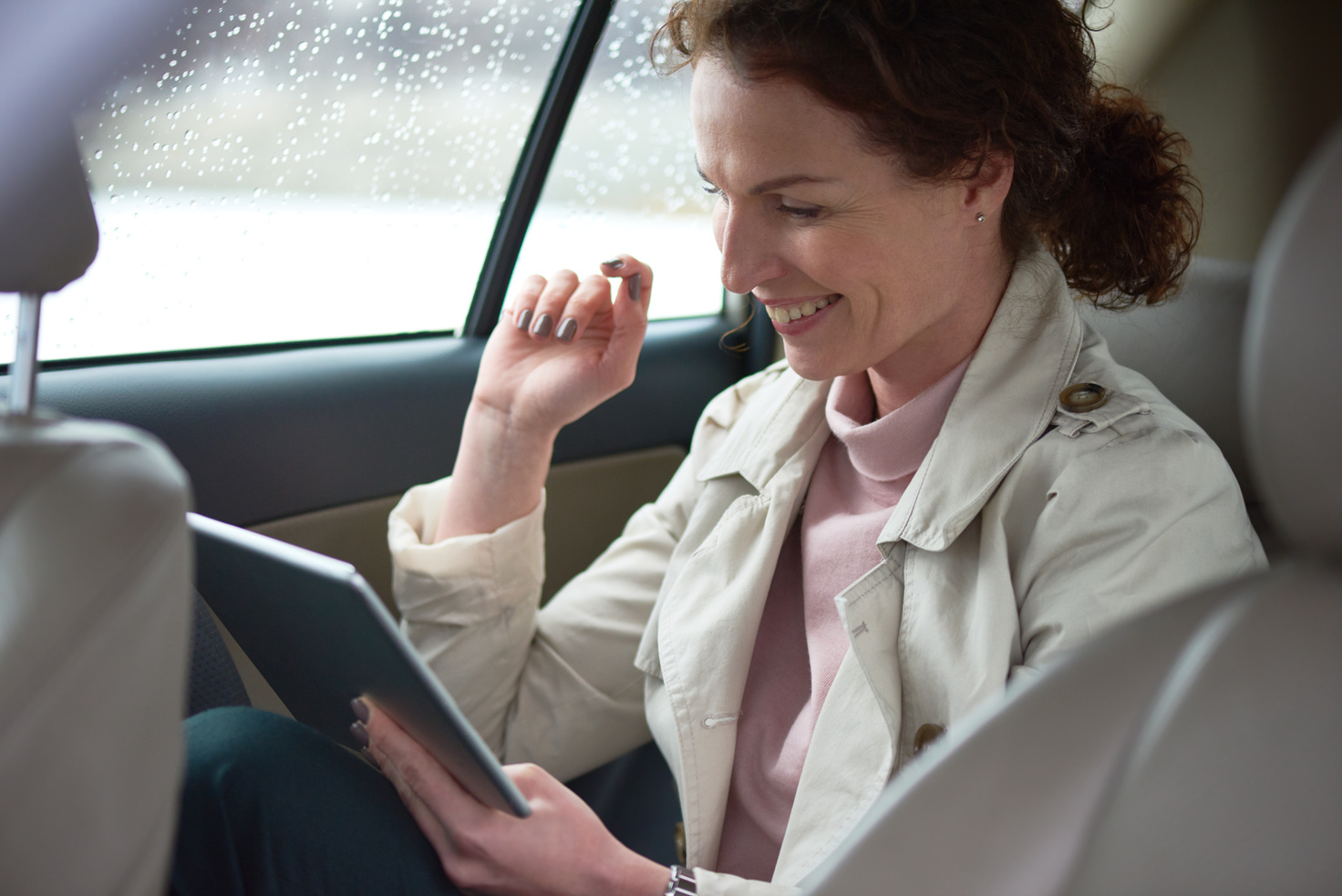 Cheerful female passenger in car